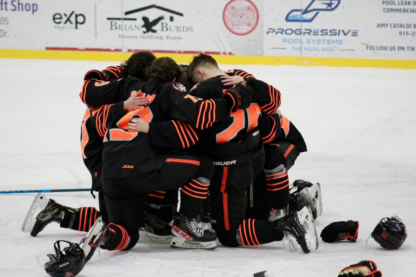 Rhinos players gather in a huddle kneeling after second consecutive loss at the hands of the New Mexico Ice Wolves